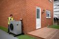 heat pump installer checking energy efficiency rating