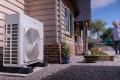 air source heat pump installed outside of the house