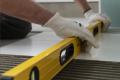 Our experts installing underfloor insulation