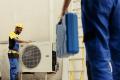 Engineer helps maintaining air source heat pumps
